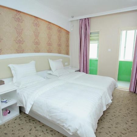 Xinghe Xinfeng Hotel Cantón Habitación foto