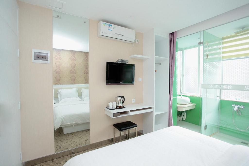 Xinghe Xinfeng Hotel Cantón Habitación foto